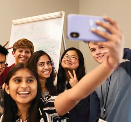 group of teens taking a selfie