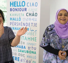 Two women celebrating Welcoming Week