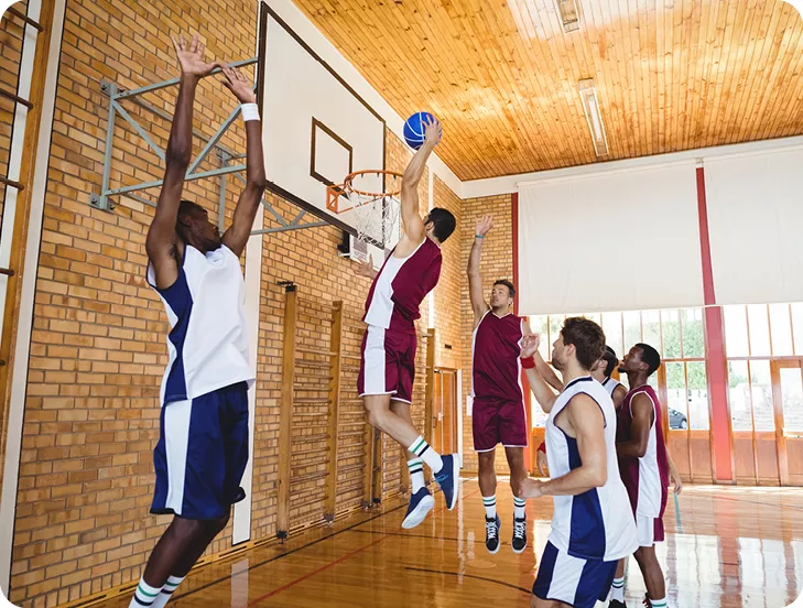 group of men playing basketball