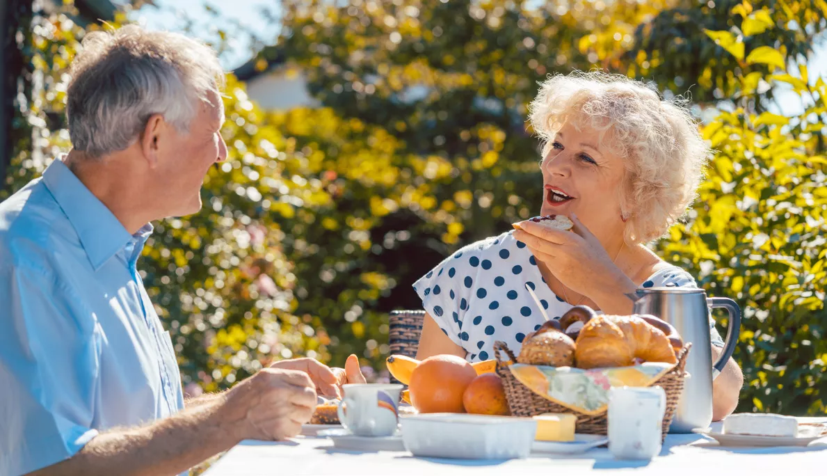 Seniors having a picnic outside