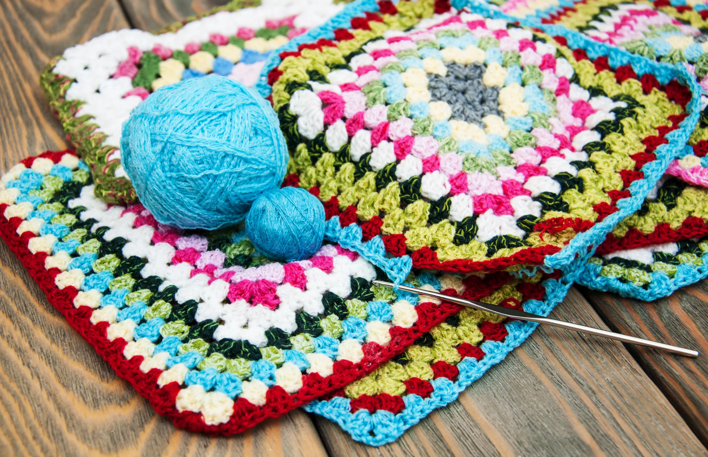 A ball of yarn and crochet materials