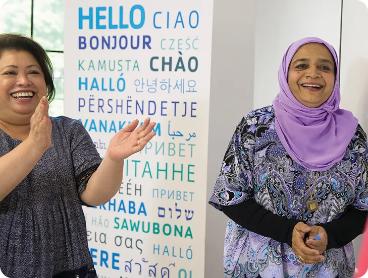 Two women celebrating Welcoming Week