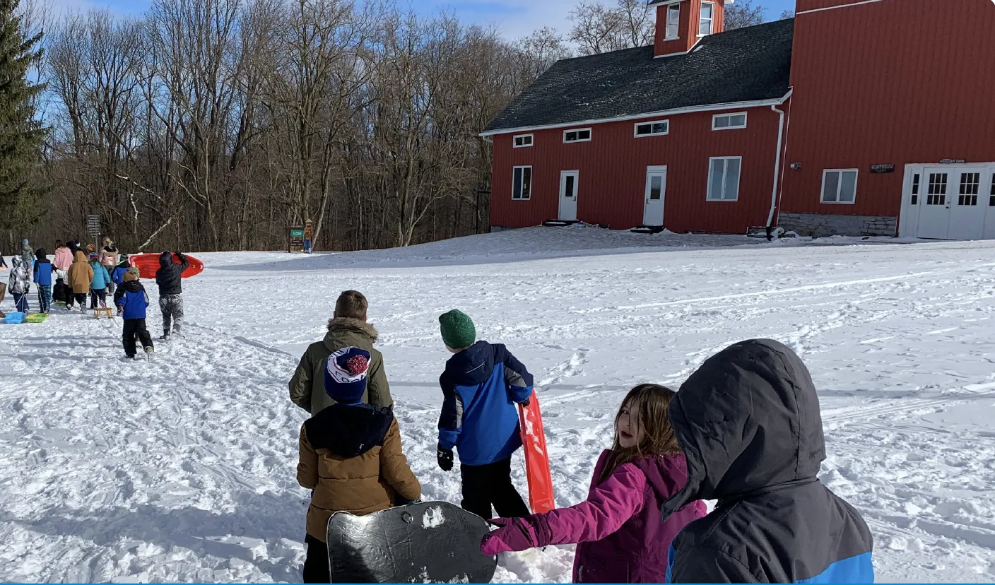 Children playing in the snow at Camp Weona