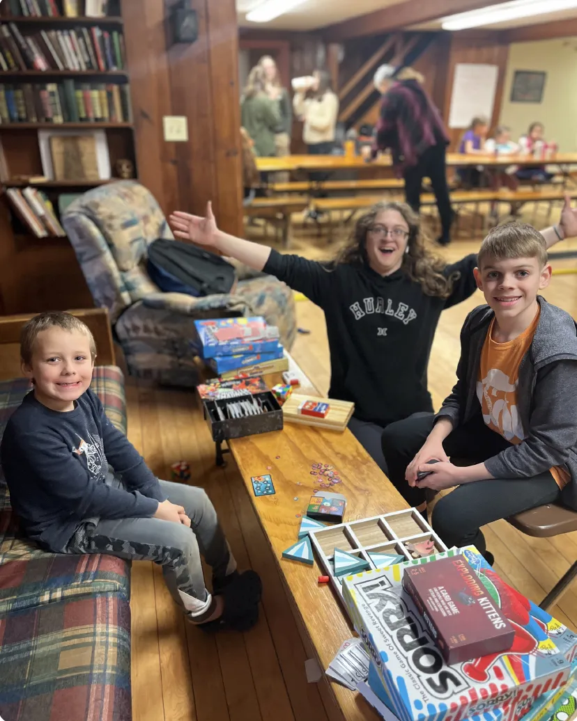 Children enjoying board games at Camp Weona