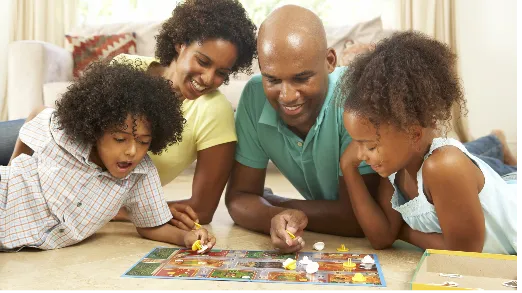 Family playing a board game