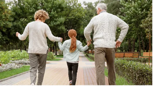 Couple walking with young girl