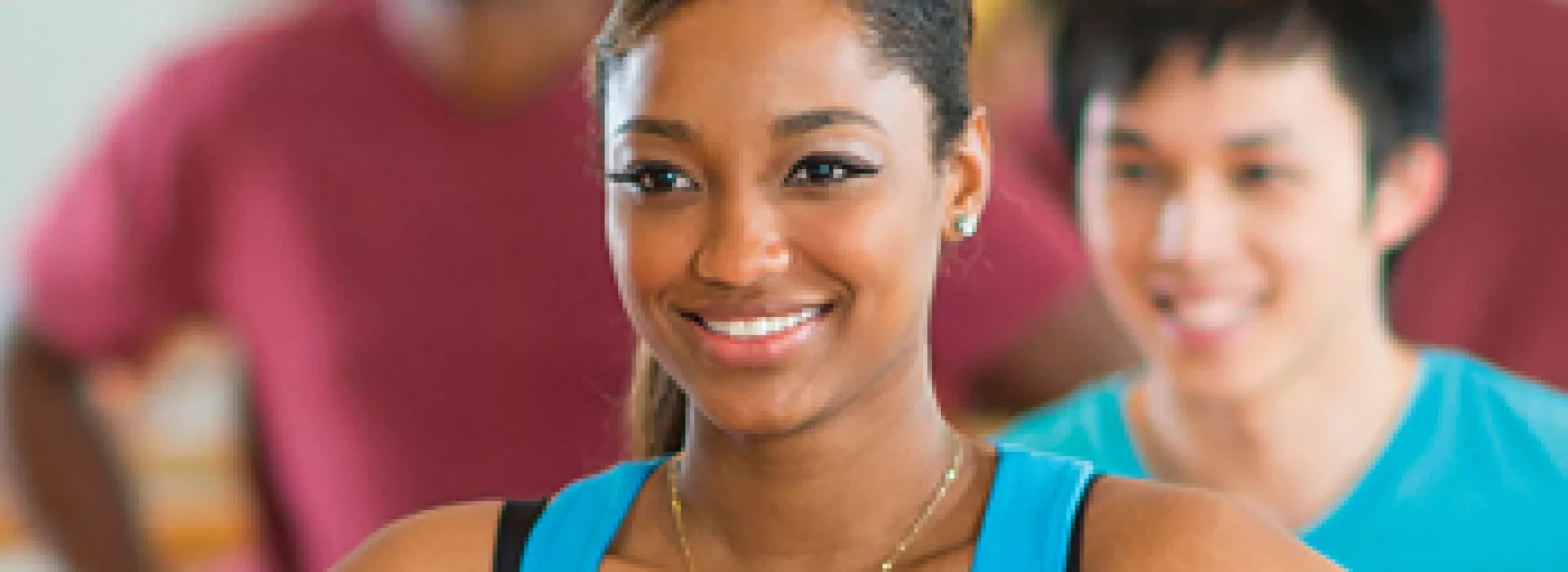 Smiling woman participating in an exercise class