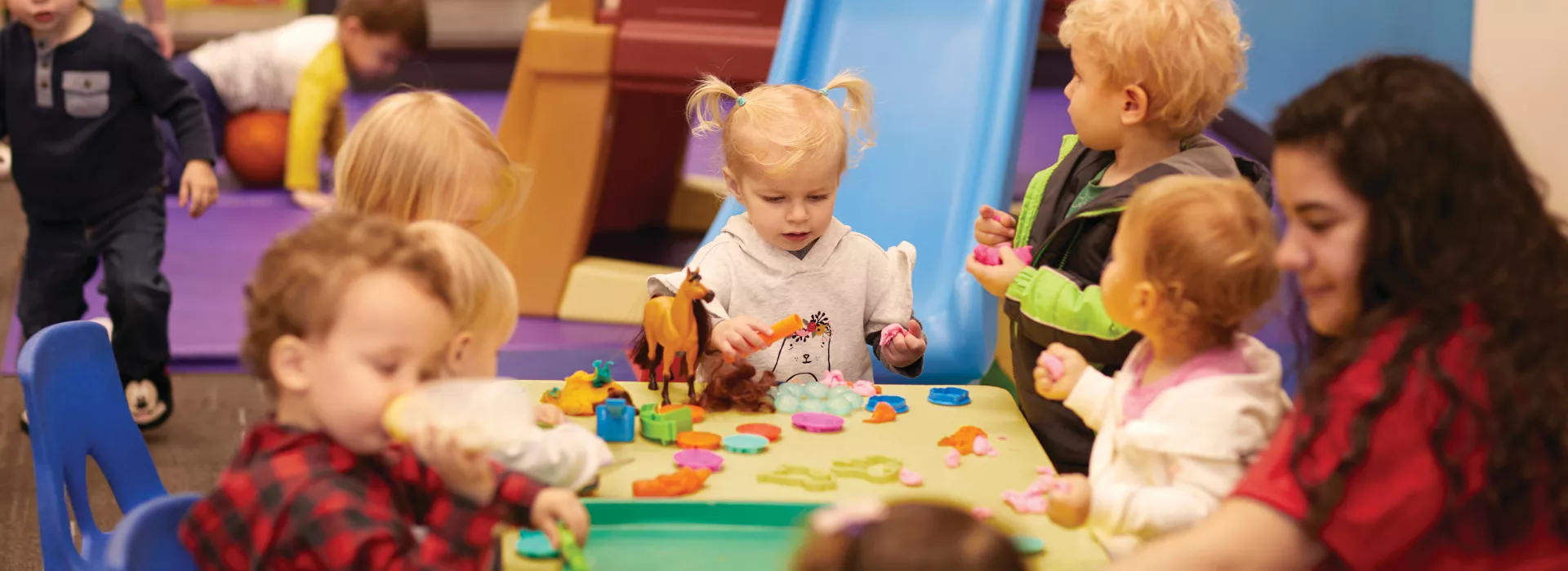 group of kids playing at table