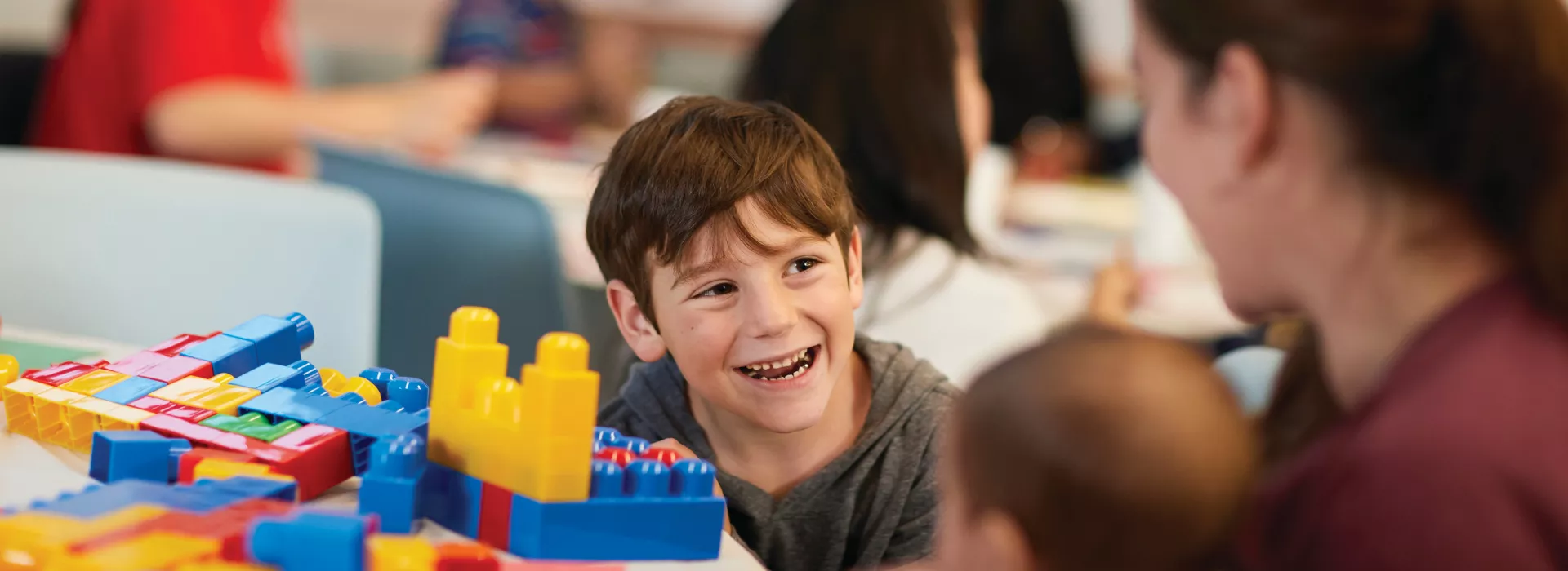 boy playing with legos