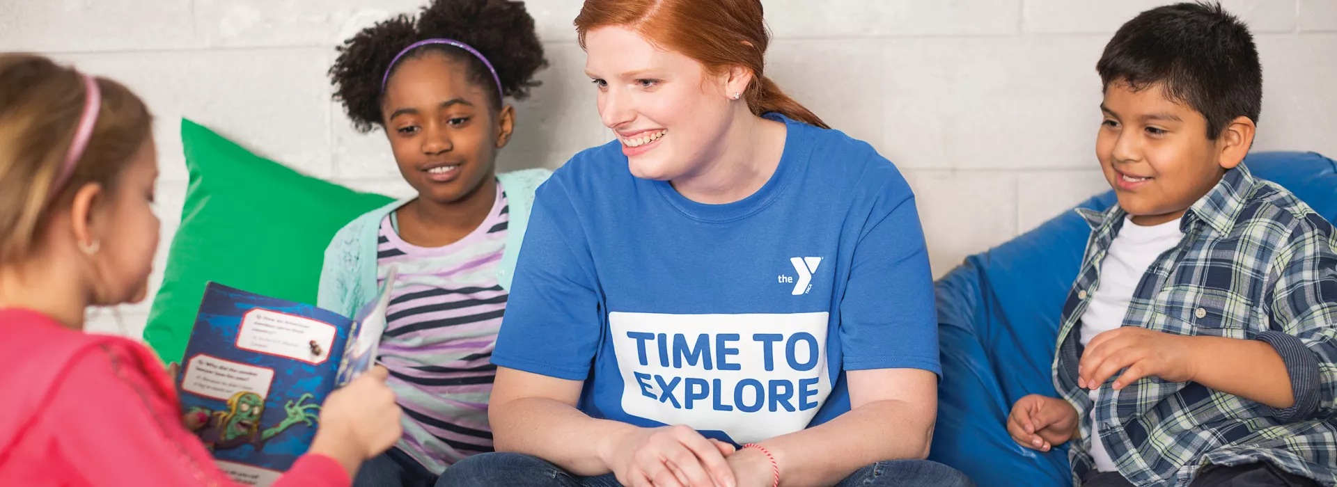 group of students reading with teacher