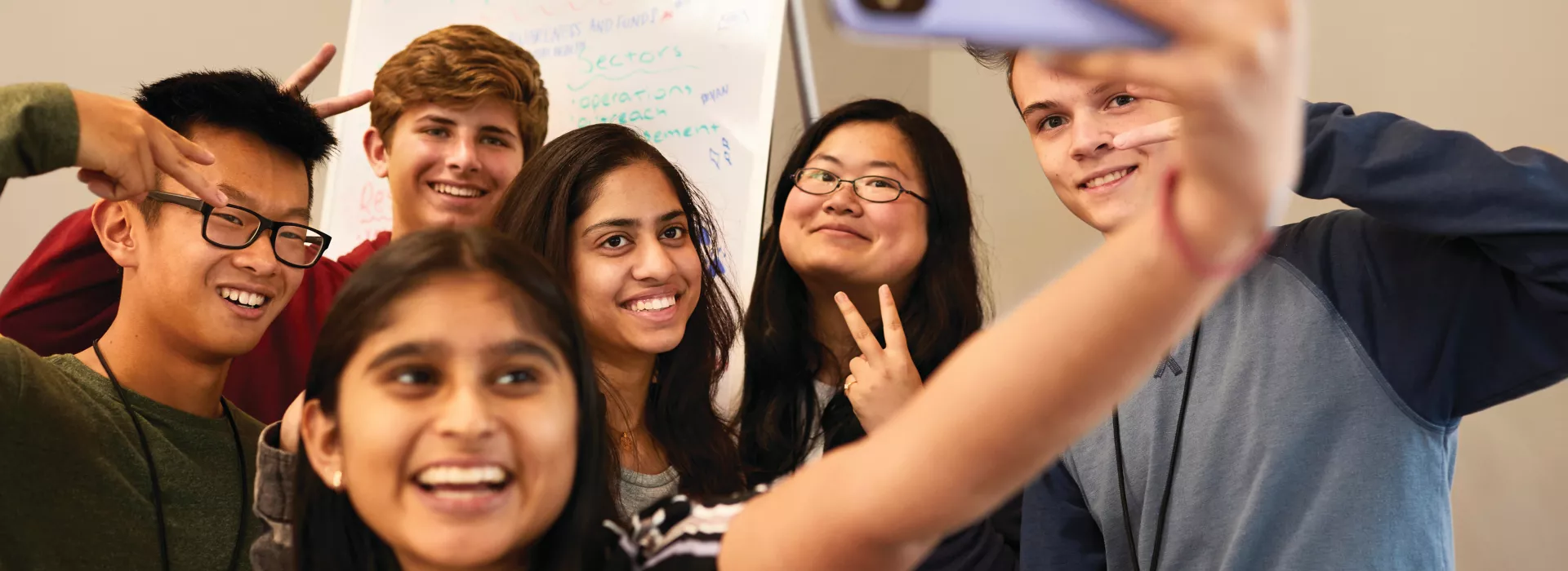 group of teens taking a selfie