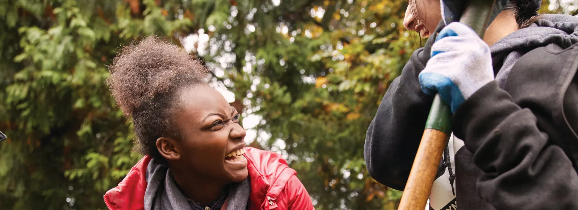 girl smiling while gardening