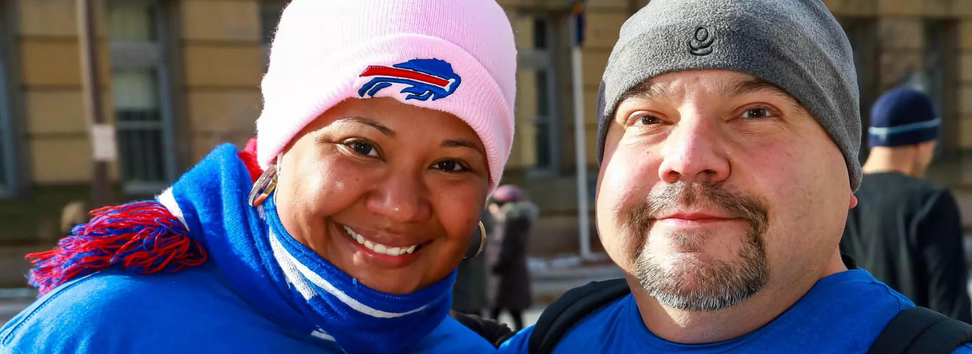 Man and woman posing for photo along race route