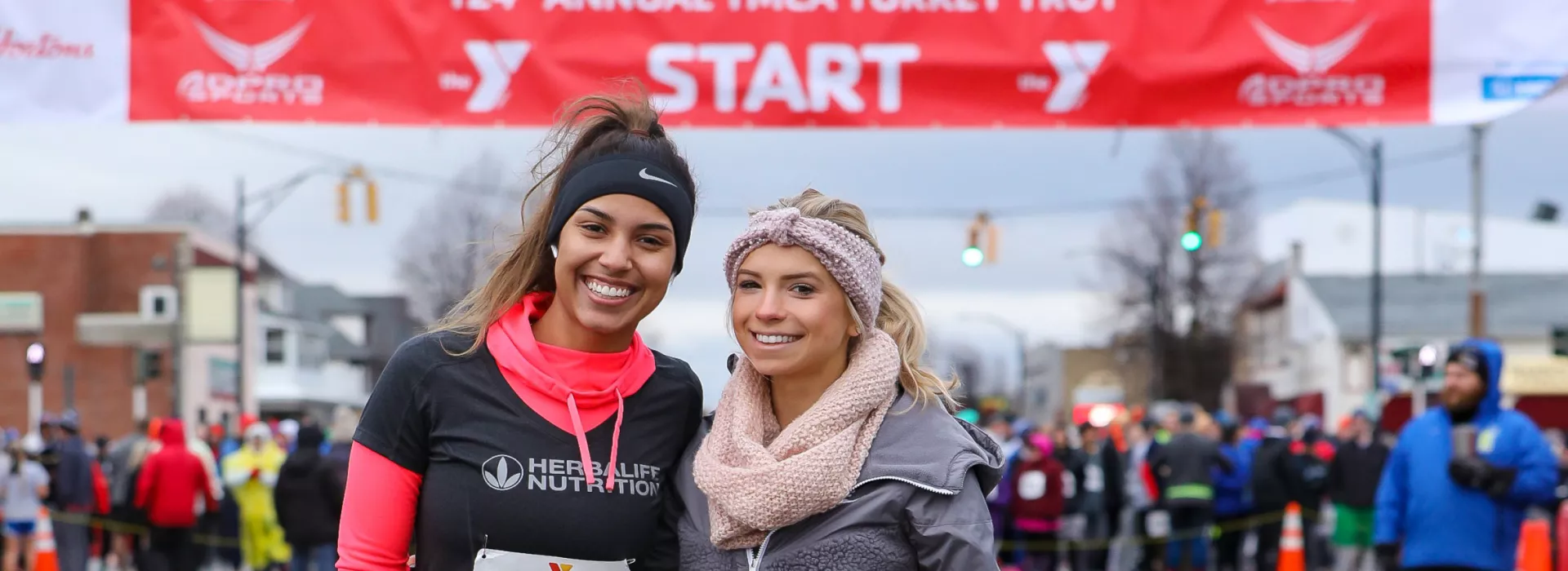 Two runners posing near start line