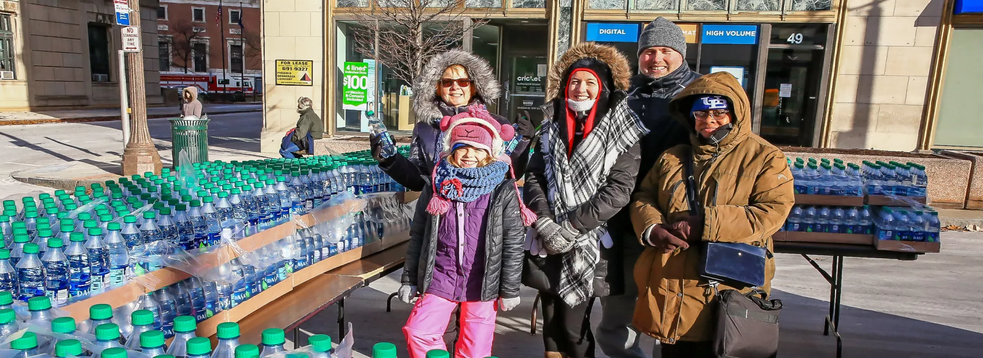 Turkey Trot volunteers handing out water along the race route